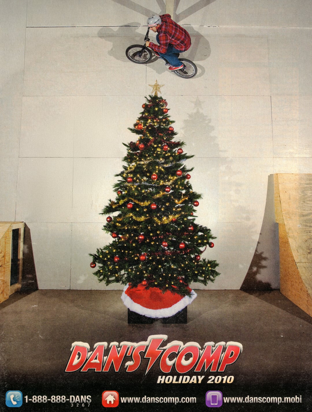 Dan's employee Derek doing a wall ride over a Christmas tree on the cover of a Dan's Comp catalog in 2010.