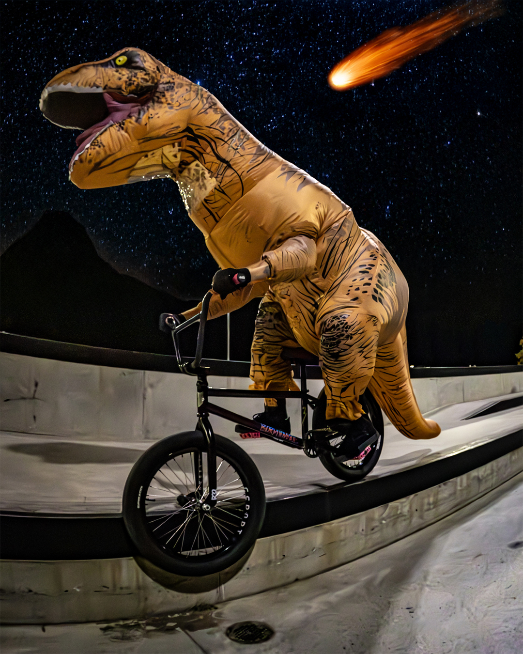 Dan's employee Jason doing a smith grind in a dinosaur costume for our Halloween shoot.