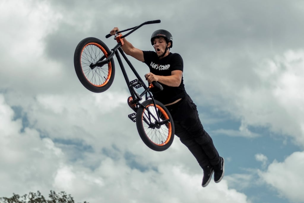 BMX freestyle rider doing a superman seat grab