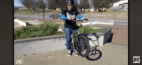 Gif of a BMX rider tossing a barspin improperly