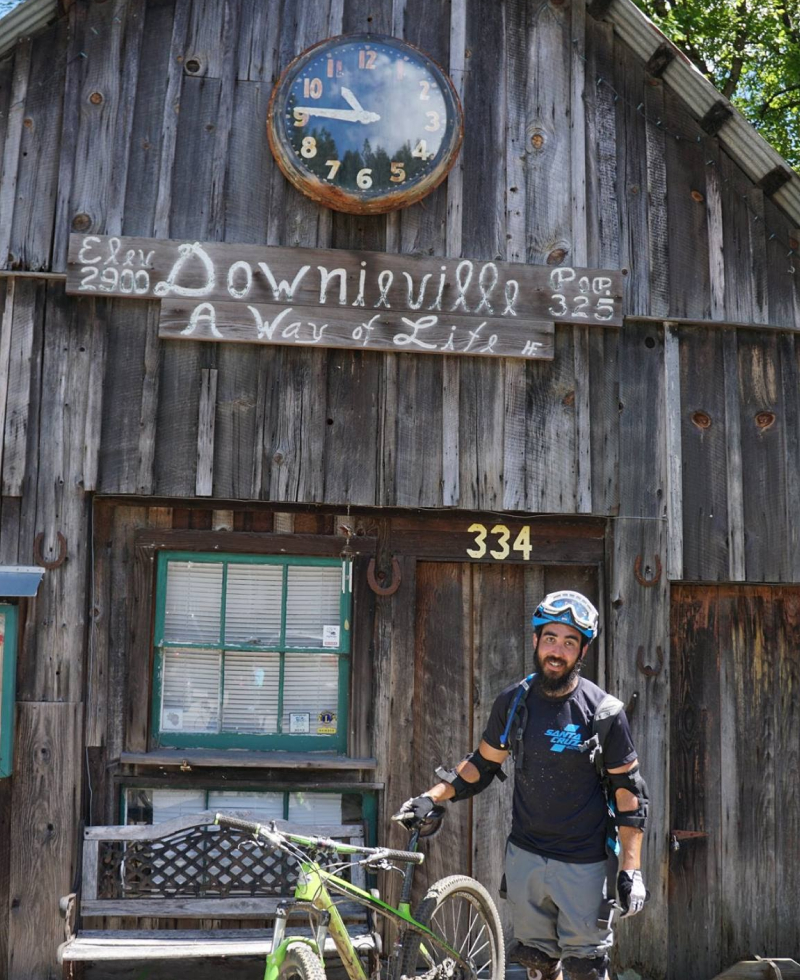 Downieville gift shop with cyclist standing in front