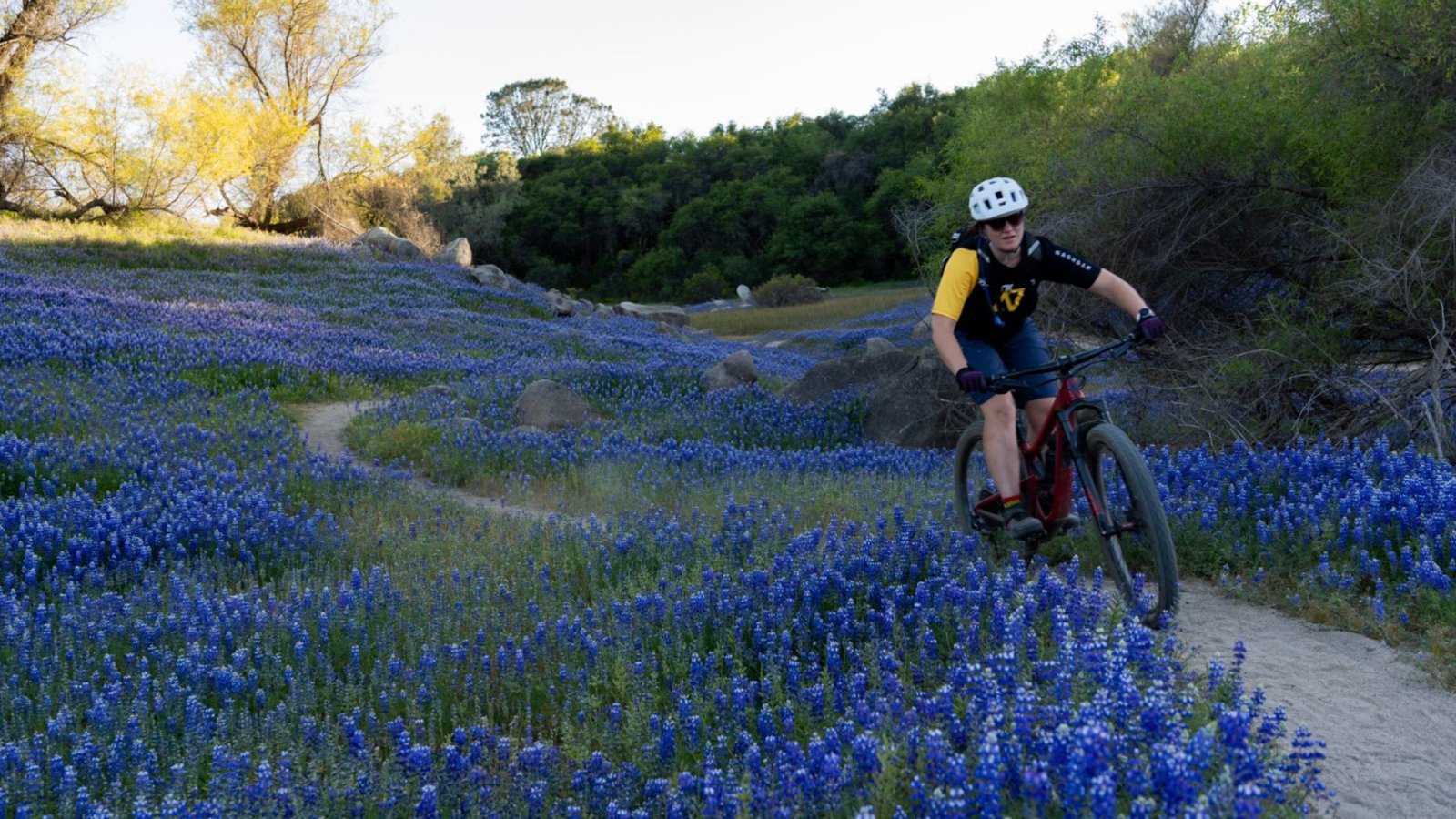 Ashley riding a loose sandy trail on the Vittoria tires.