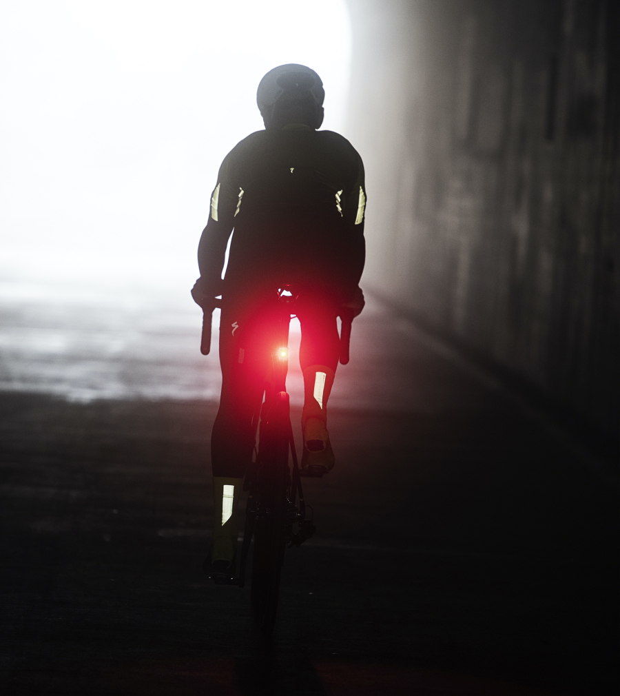 cyclists riding at night with a taillight