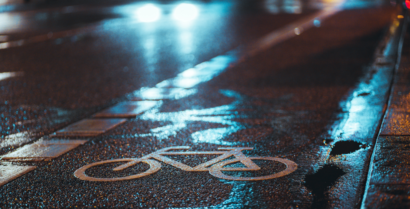 bike lane symbol on pavement at night