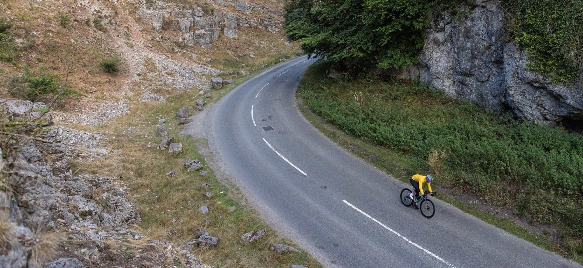 Road bike cyclist riding on downhill