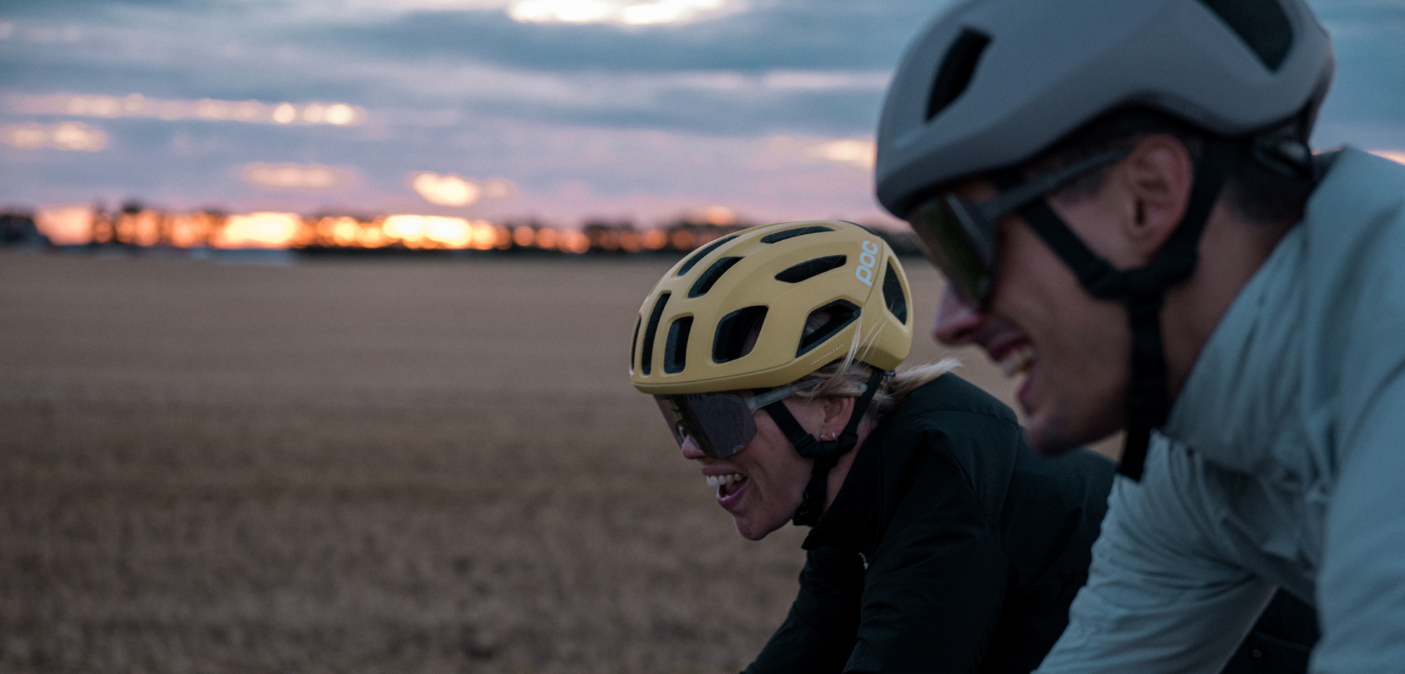 image of women and man riding wearing POC helmets and sunglasses