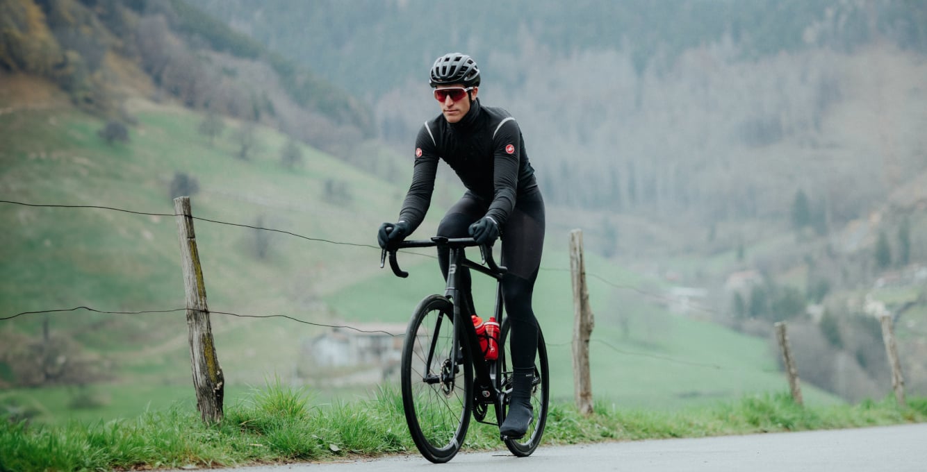 Cyclist looking at garmin computer on bike