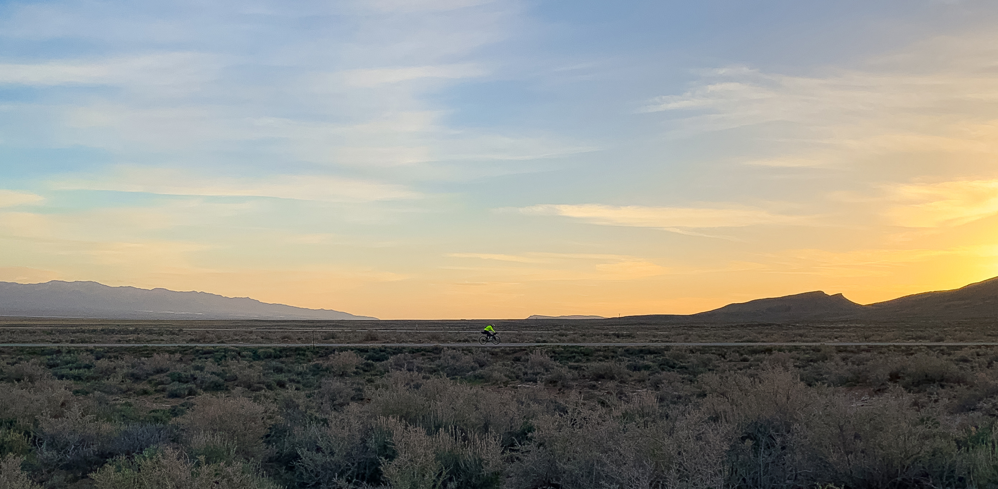 Man bikepacking in the distance