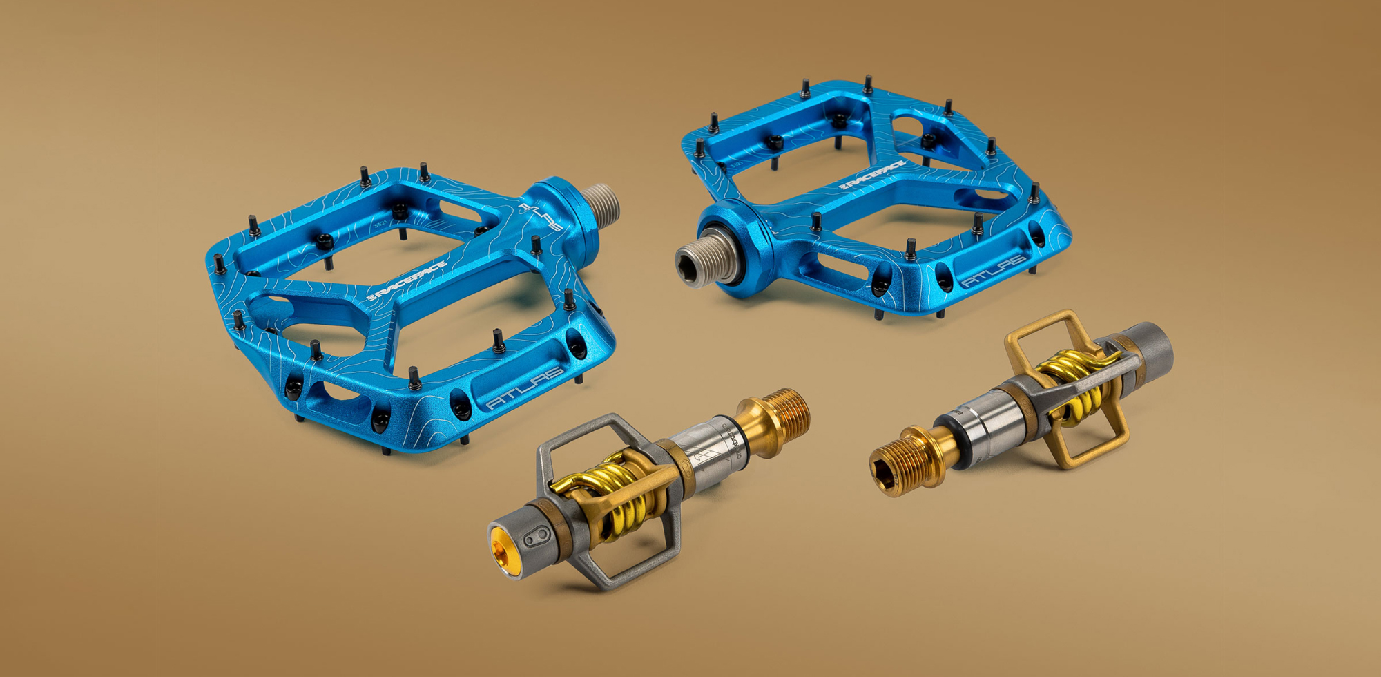 Blue Raceface flat pedals and Titanium/Gold Crankbrother clipless pedals