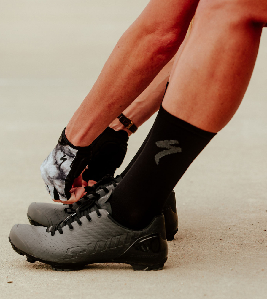 Woman tying laces on S-Works Recon shoes