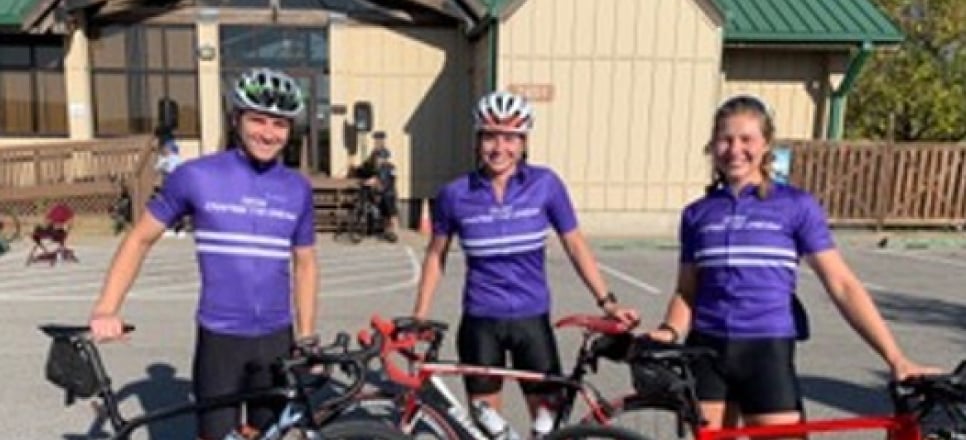 Claire and her team posing with their bike after the event