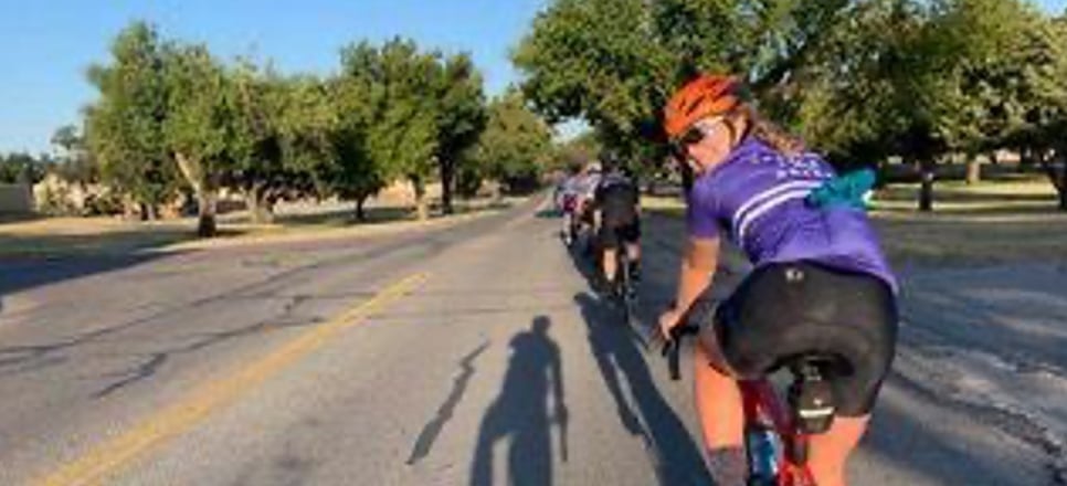 Claire looking behind her while riding her bike during the event