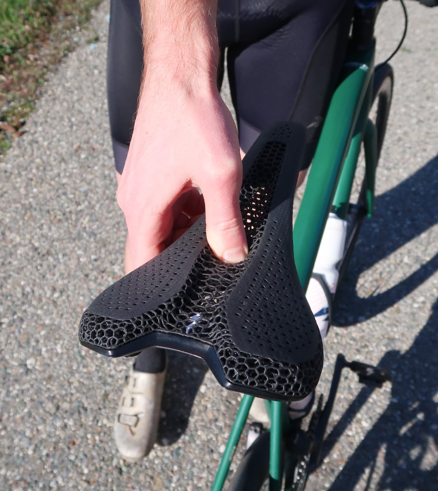cyclist pressing thumb into a bike saddle