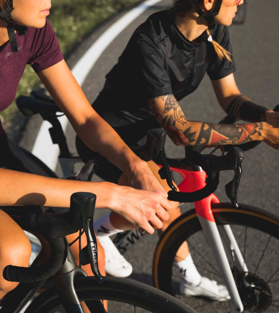 Two women pictured riding Specialized S-Works road bikes