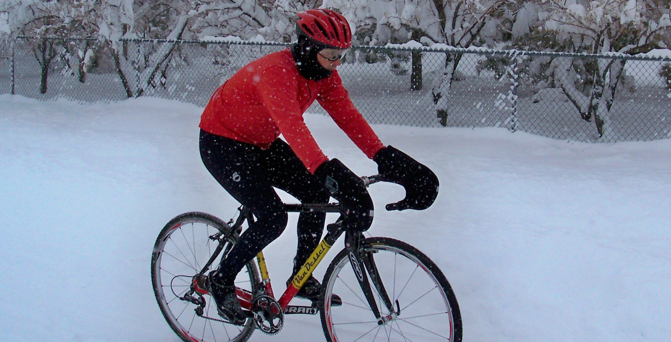 Winter cyclist riding on the snow