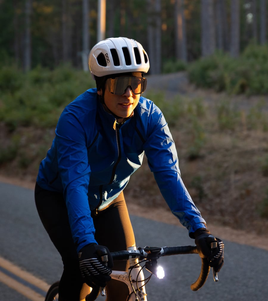 A cyclist riding in cold weather