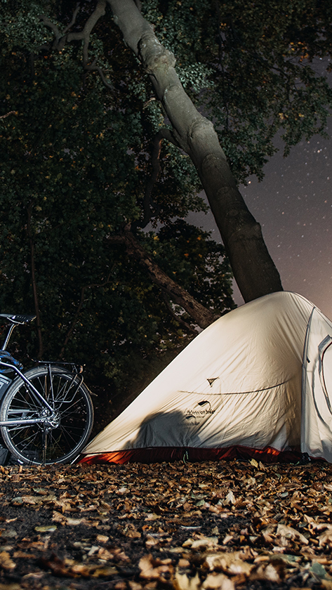 bikepacker camping at night