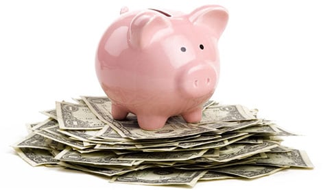 Piggy bank on top of money