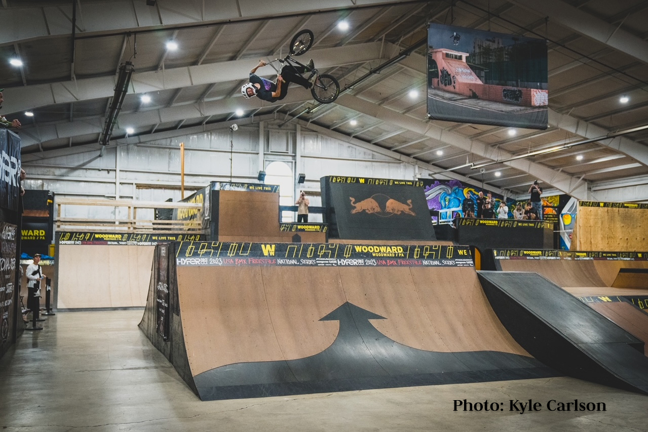 Aaden Reed boosting a 360 backflip on the legendary box jump at Camp Woodwards Lot 8 Park.