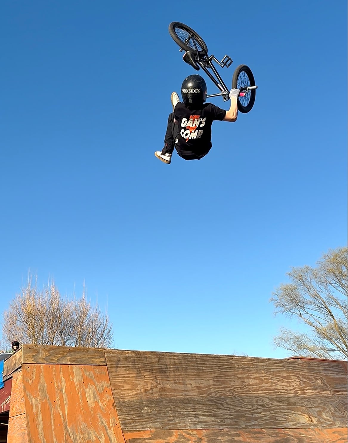 Cullen Sumner launching a flip whip on his back yard ramp.