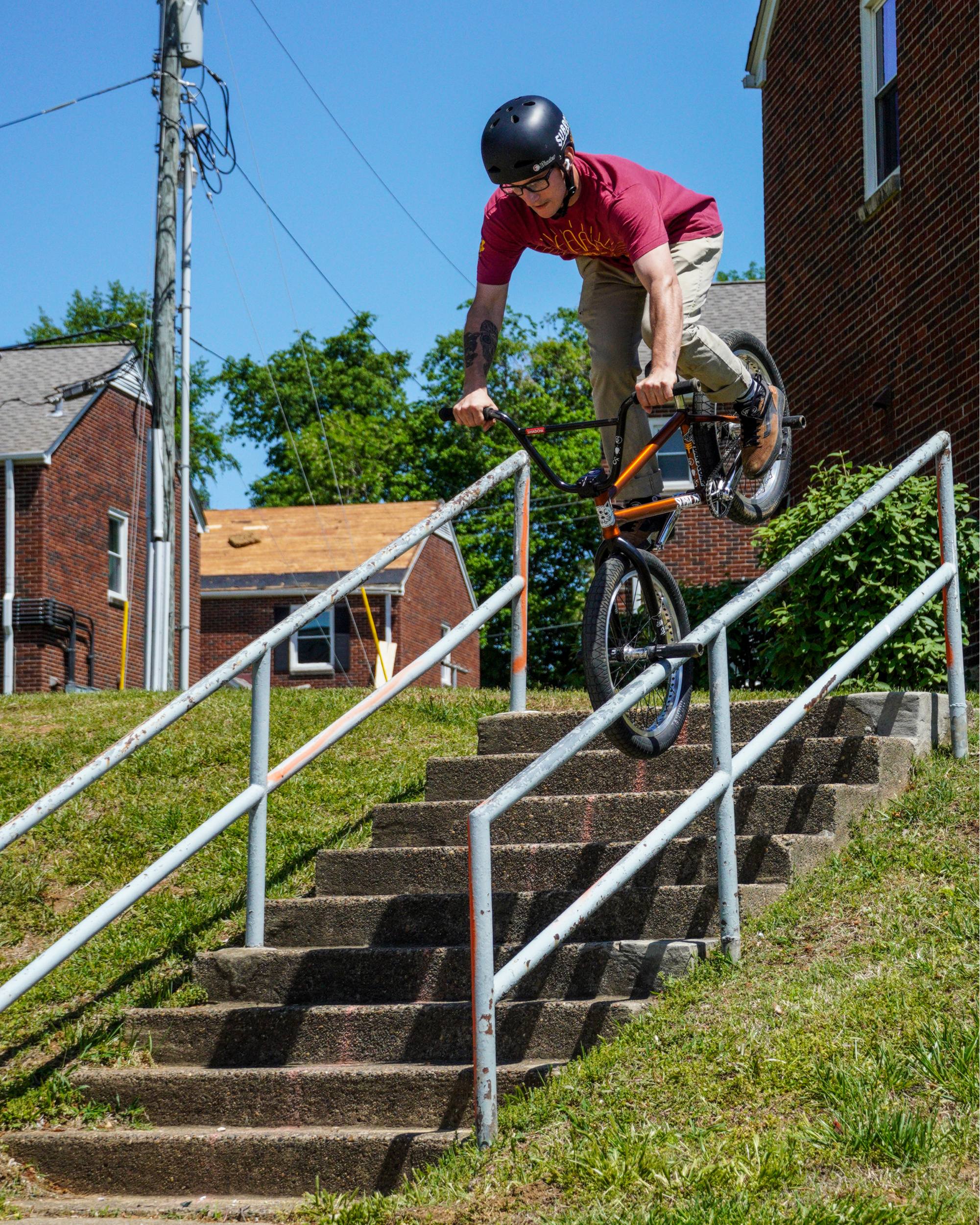 Dan's Comp Flow Team rider Deegan Boone doing a tooth pick hang over grind down a stair set.