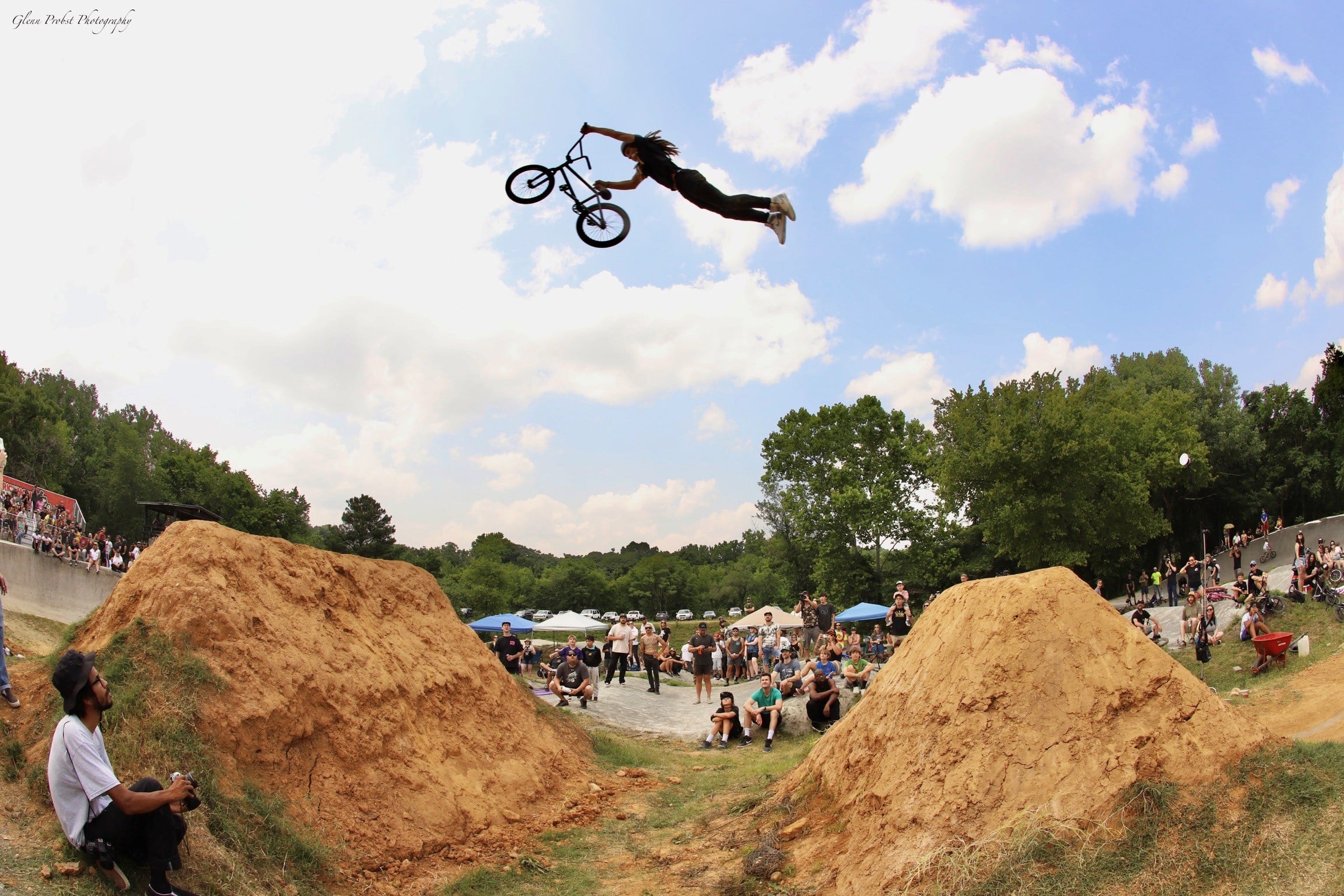 Dan's Comp Flow Team rider Tyler Hill doing a massive superman seat grab over a big dirt jump.