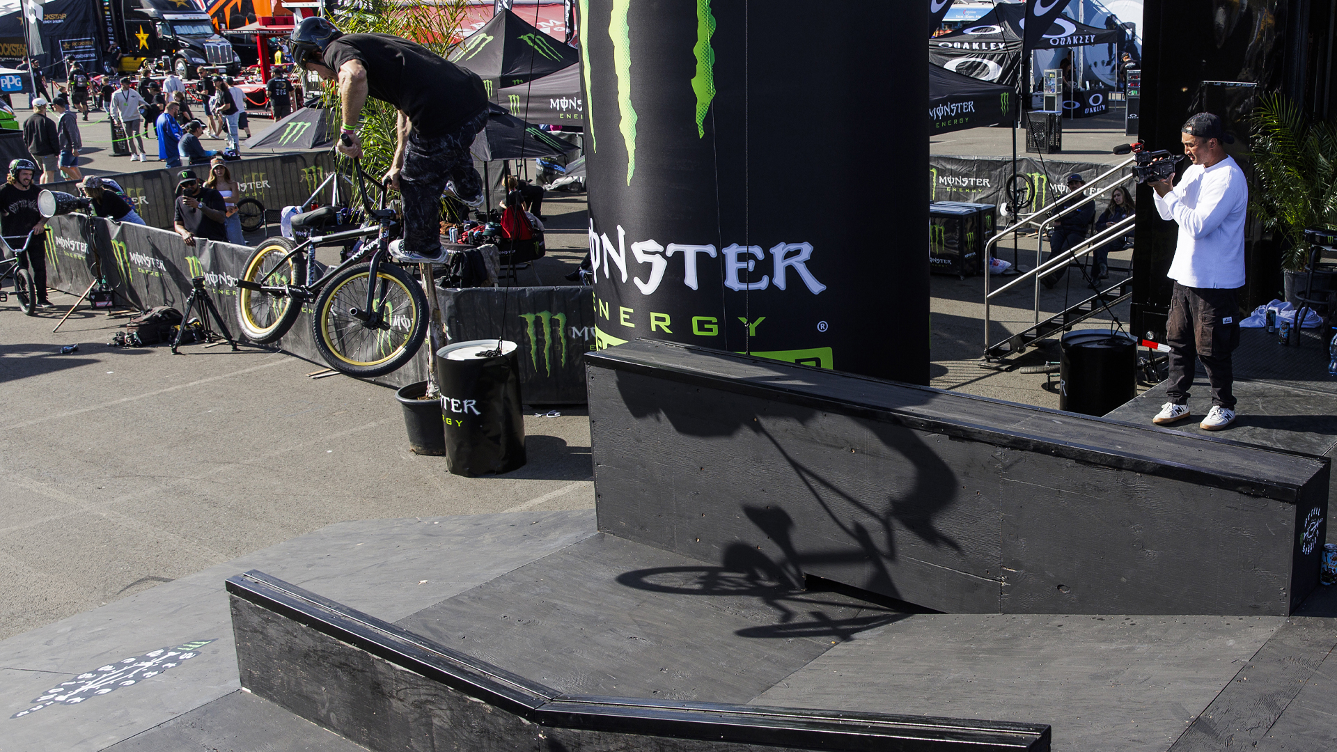 Dan Kruk doing a tailwhip at the Monster Energy BMX street event at the San Diego supercross event.