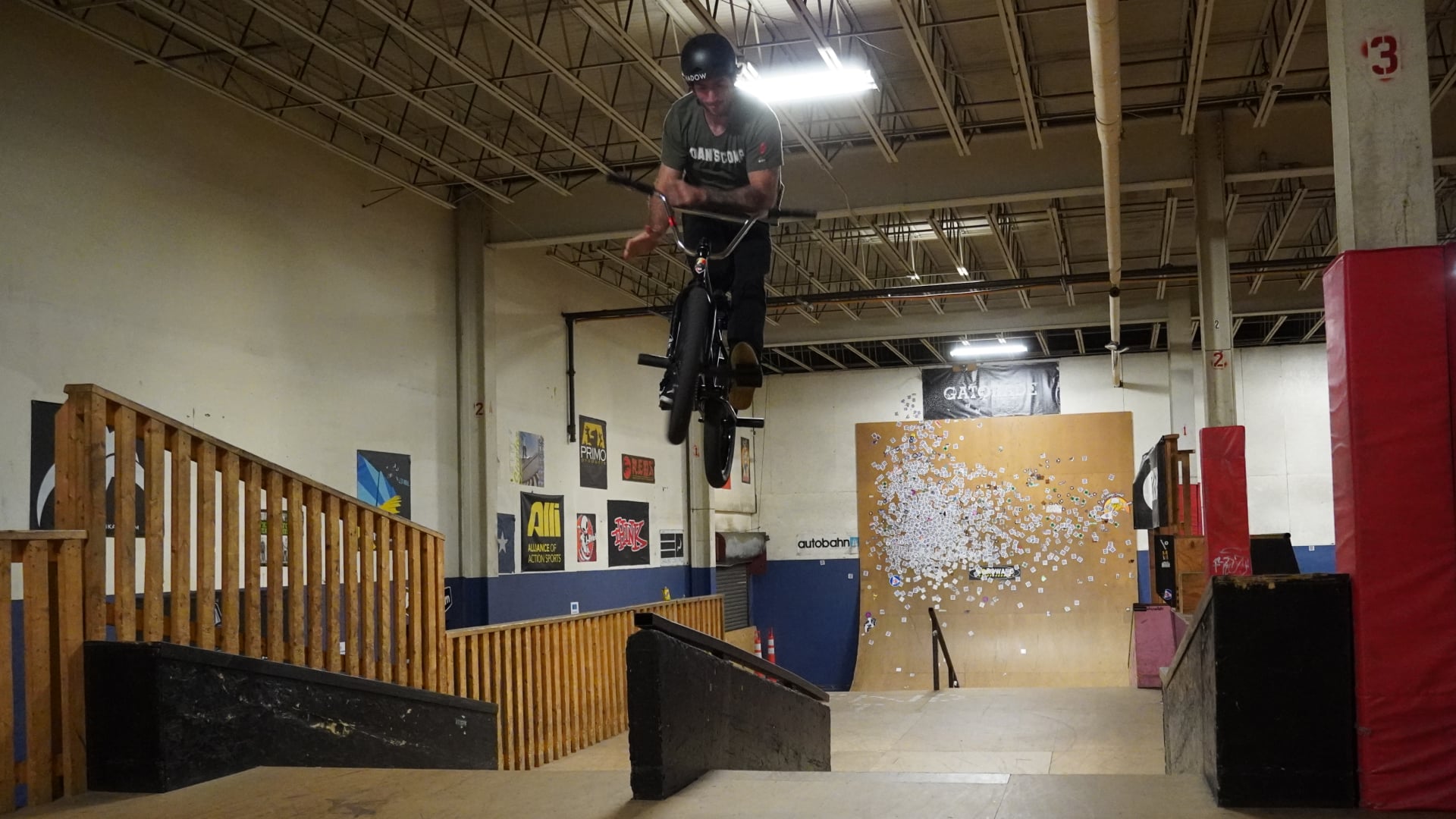 Matt Ray doing a rail ride to bar spin at The Edge Indoor Skatepark.