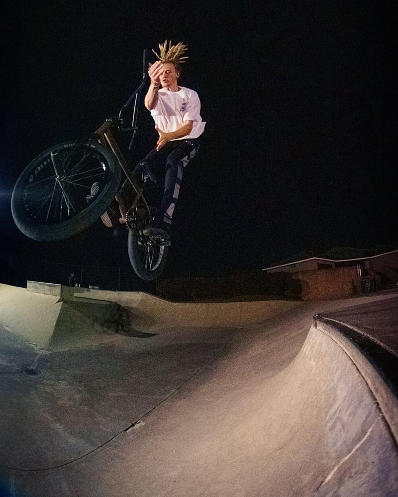 Dans Comp syndicate Chris Seaton with a bar spin. BMX.