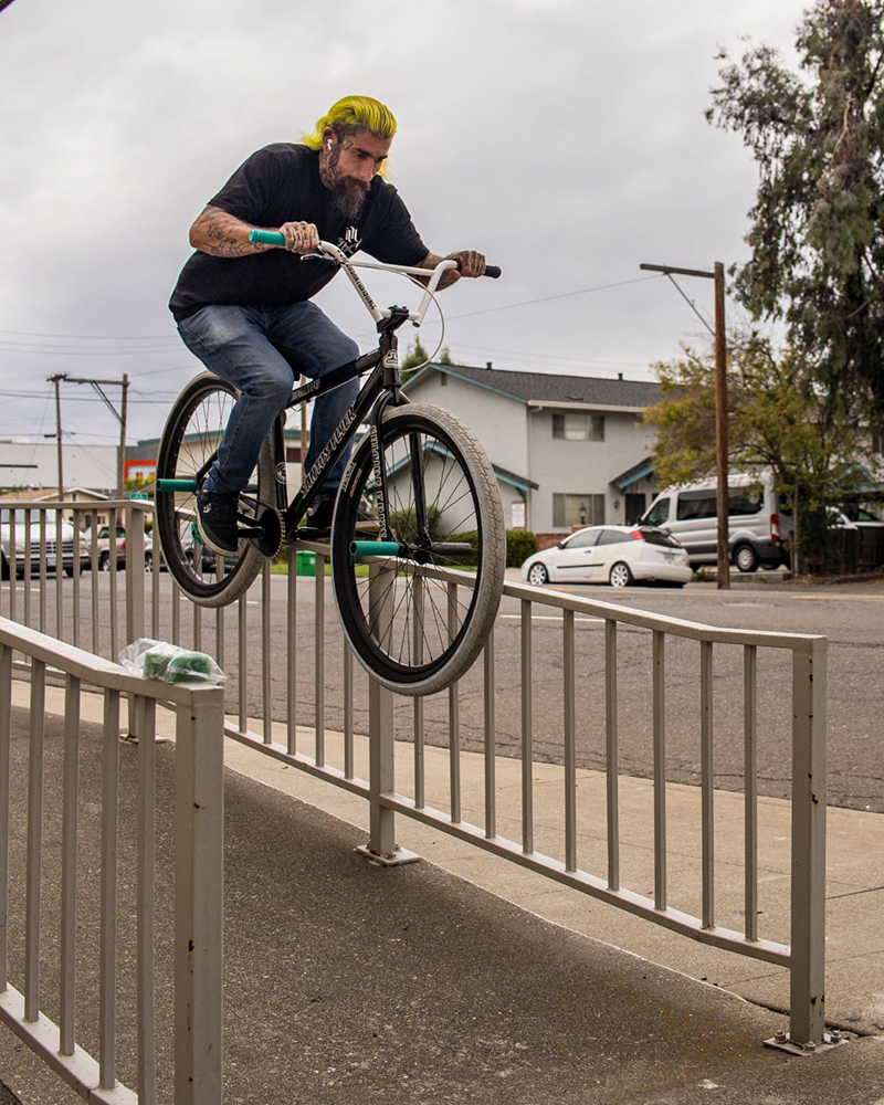 Dans Comp syndicate and Bike Life extraordinaire Jakob Santos grinding a hand rail on his 29 SE Bike.